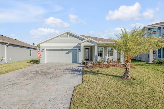 view of front facade featuring a front yard and a garage