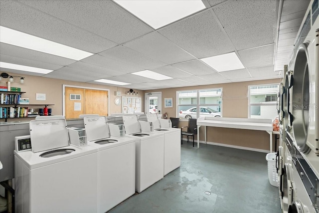 washroom featuring separate washer and dryer and stacked washer / dryer