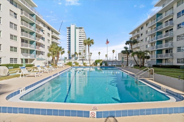 view of swimming pool with a patio