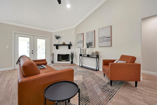 living room with ornamental molding, light wood-type flooring, french doors, and vaulted ceiling