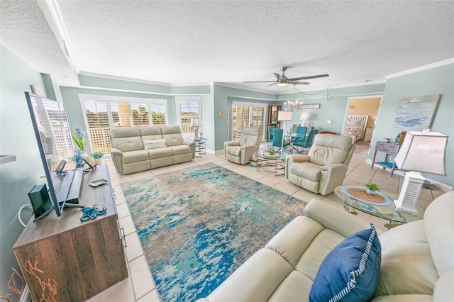 living room featuring a textured ceiling, ceiling fan, crown molding, and light tile patterned flooring