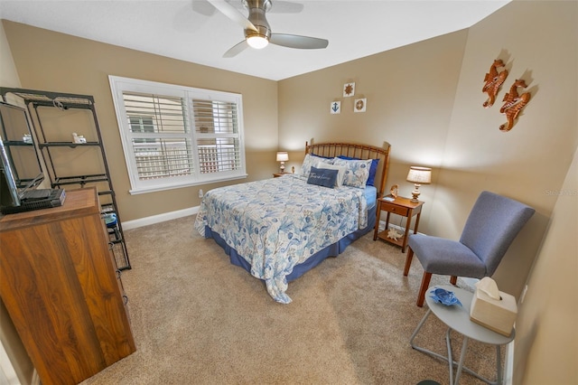 bedroom featuring ceiling fan and light carpet