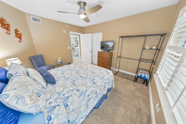 bedroom featuring ceiling fan and light colored carpet