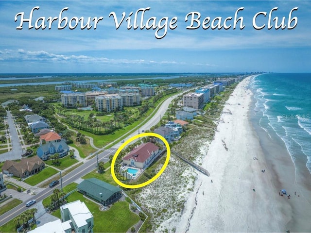 aerial view featuring a water view and a view of the beach