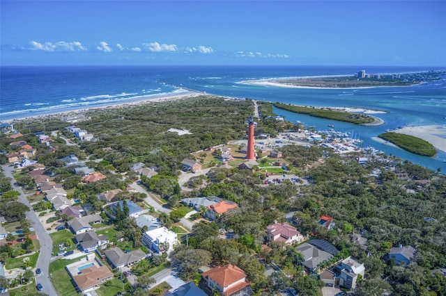 birds eye view of property with a beach view and a water view