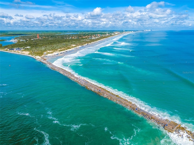 bird's eye view featuring a view of the beach and a water view