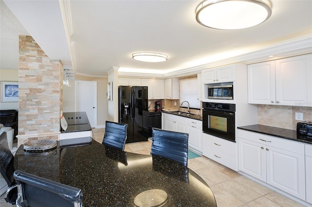 kitchen featuring tasteful backsplash, ornamental molding, sink, black appliances, and white cabinetry