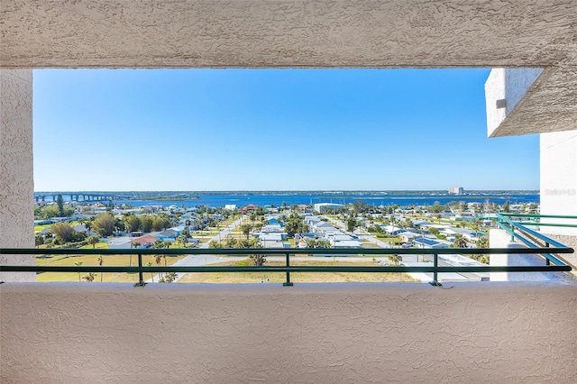 balcony featuring a water view