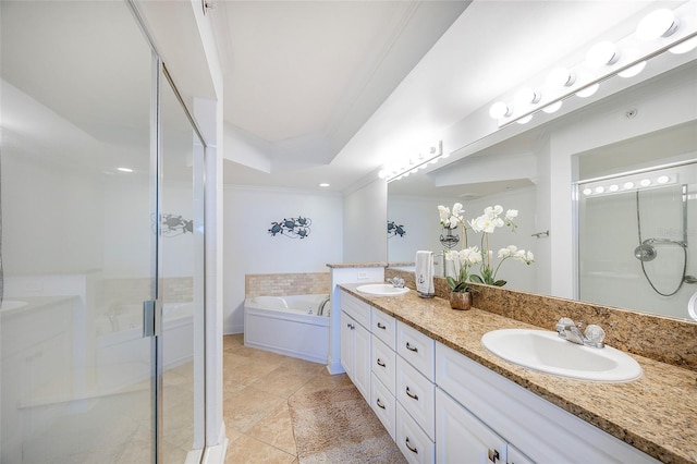 bathroom with tile patterned floors, vanity, ornamental molding, and shower with separate bathtub