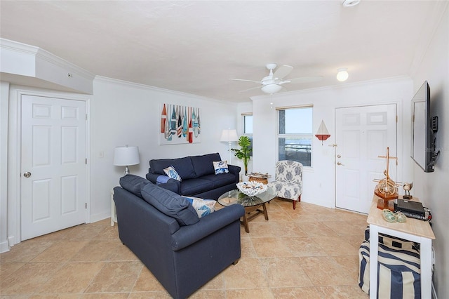 living room with ceiling fan and crown molding