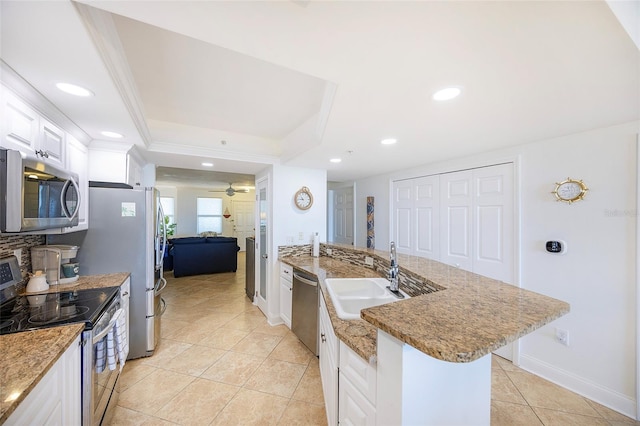 kitchen with white cabinets, sink, ceiling fan, light tile patterned floors, and stainless steel appliances