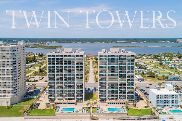 birds eye view of property with a water view