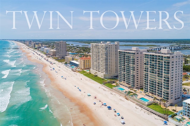 bird's eye view with a water view and a view of the beach