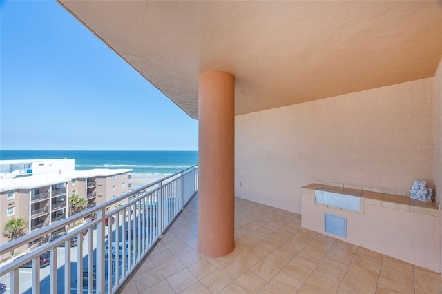 balcony featuring a water view