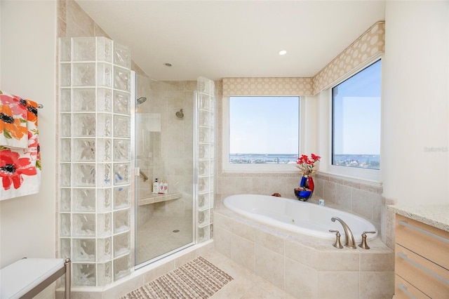 bathroom featuring tile patterned flooring, vanity, and independent shower and bath