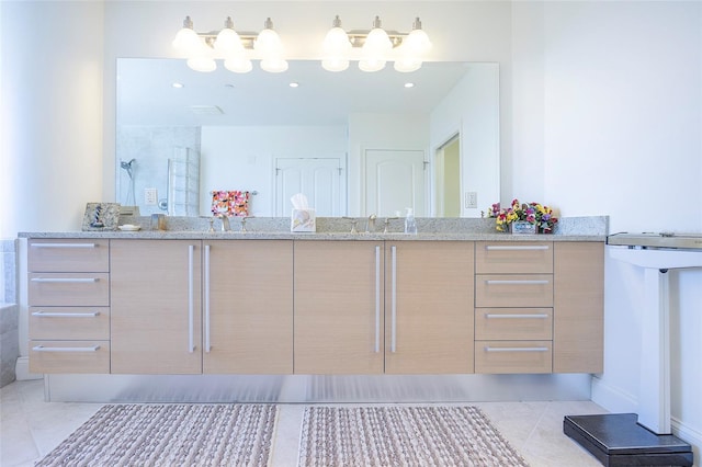 bathroom featuring tile patterned flooring and vanity