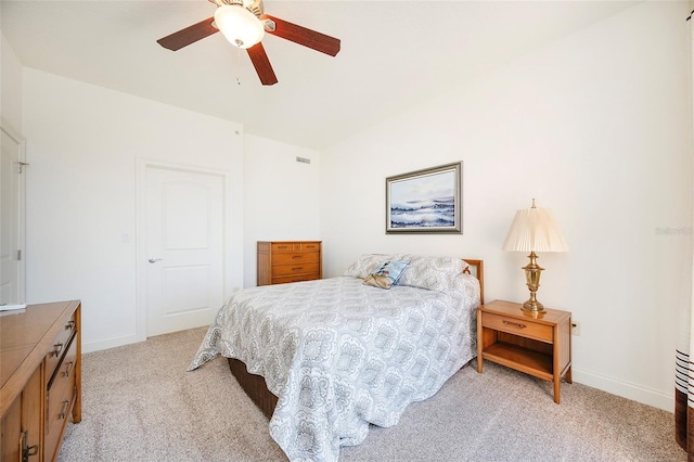 bedroom featuring ceiling fan and light carpet