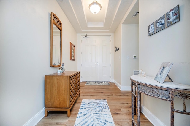 entryway with light hardwood / wood-style floors