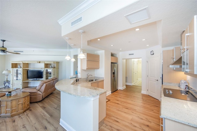 kitchen with sink, light wood-type flooring, kitchen peninsula, and stainless steel refrigerator with ice dispenser