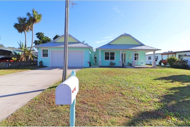 view of front of property with a porch, a front yard, and a garage