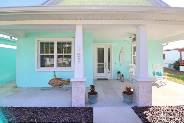 entrance to property featuring ceiling fan