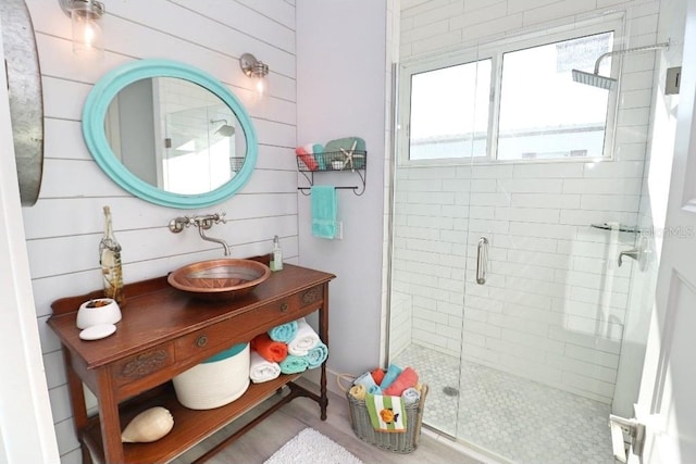 bathroom featuring vanity and an enclosed shower