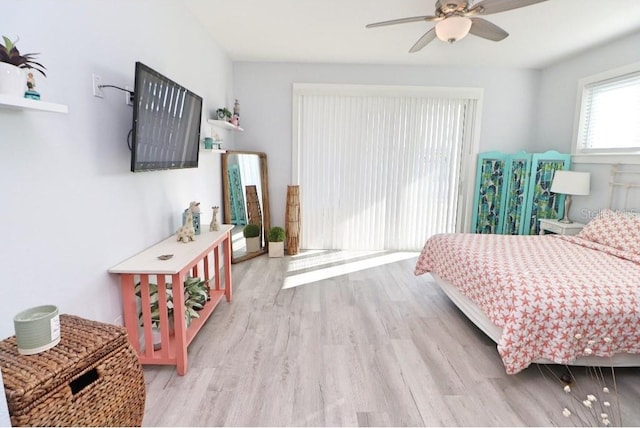 bedroom with ceiling fan and light hardwood / wood-style flooring