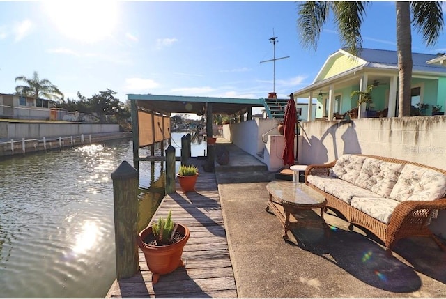 view of patio / terrace featuring a water view and an outdoor hangout area