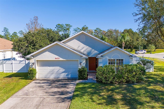 ranch-style house featuring a front yard and a garage