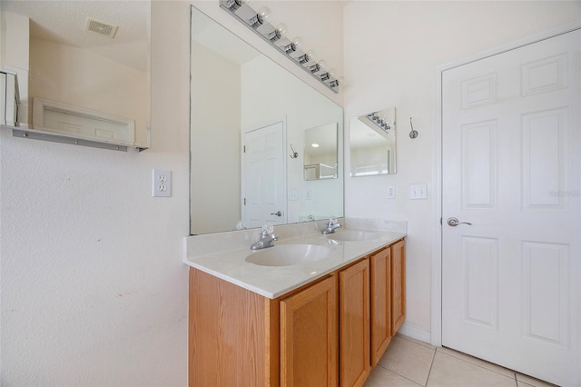 bathroom featuring vanity and tile patterned floors