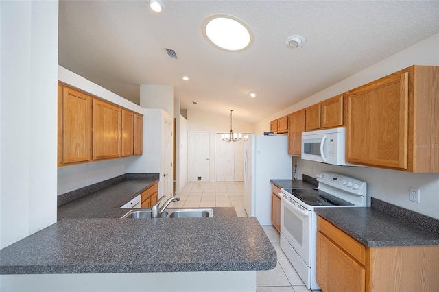 kitchen with sink, a chandelier, lofted ceiling, white appliances, and decorative light fixtures