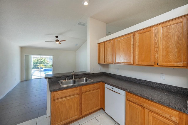 kitchen featuring white dishwasher, sink, vaulted ceiling, ceiling fan, and kitchen peninsula