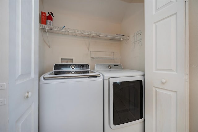 laundry room featuring washing machine and dryer