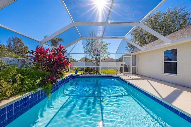 view of pool featuring a patio and a lanai