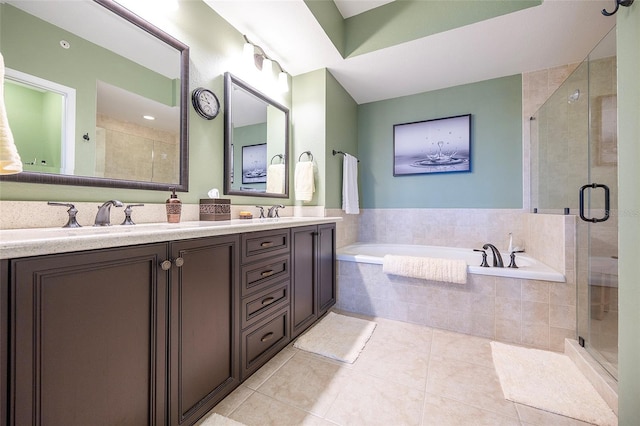 bathroom featuring tile patterned floors, vanity, and plus walk in shower