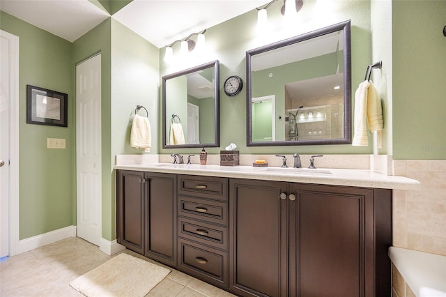 bathroom with vanity, tile patterned floors, and a shower with shower door