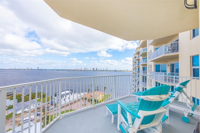 balcony featuring a water view