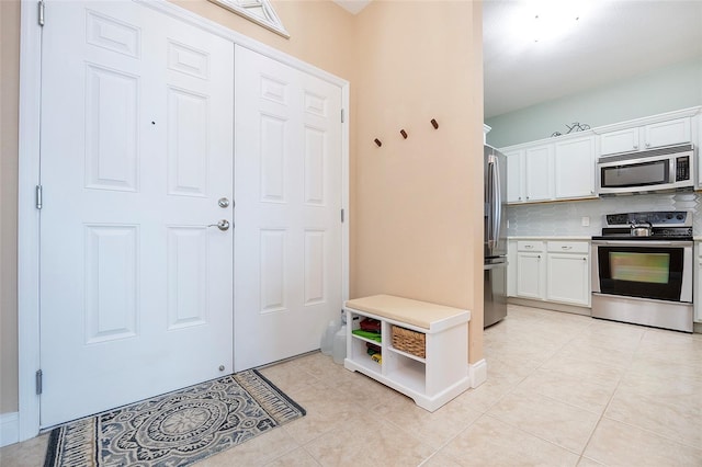 mudroom featuring light tile patterned floors