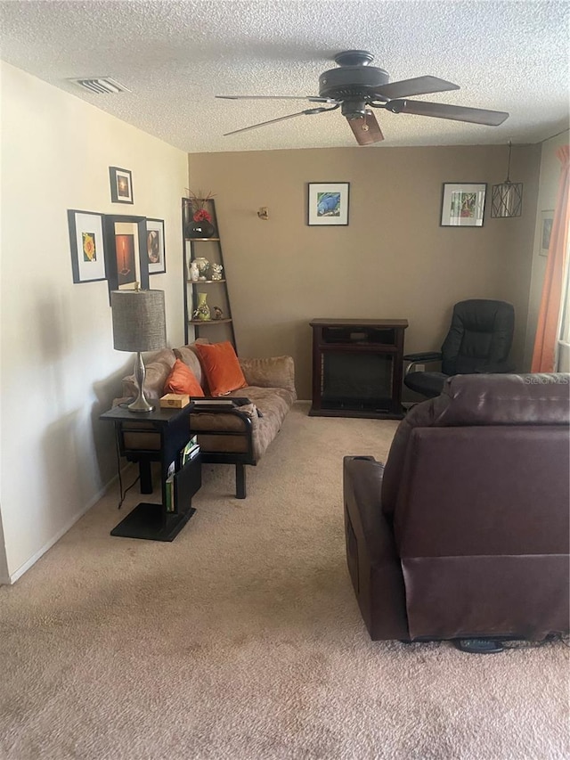 2017 Royal Palm Dr, Edgewater, FL 32141 - carpeted living room with a textured ceiling and ceiling fan
