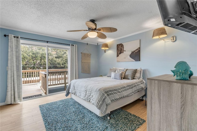 bedroom with ceiling fan, crown molding, light hardwood / wood-style floors, a textured ceiling, and access to outside