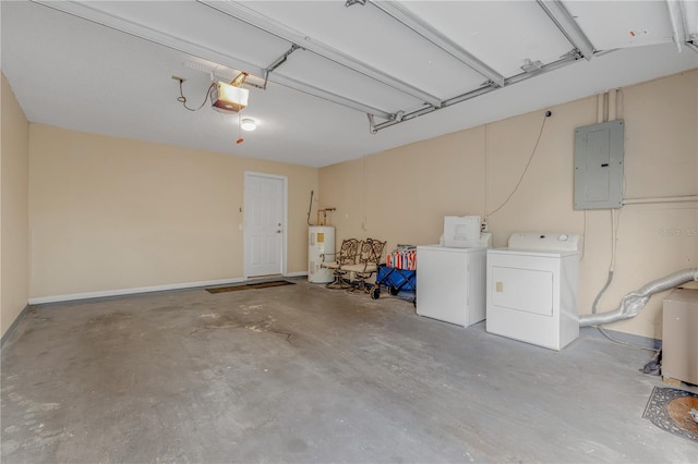 garage featuring washer and clothes dryer, a garage door opener, electric panel, and water heater