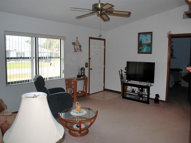 living room featuring light colored carpet, ceiling fan, and lofted ceiling