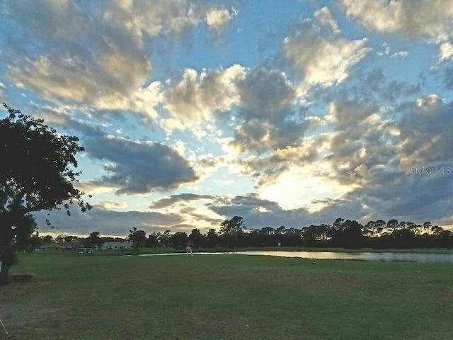 view of community with a water view