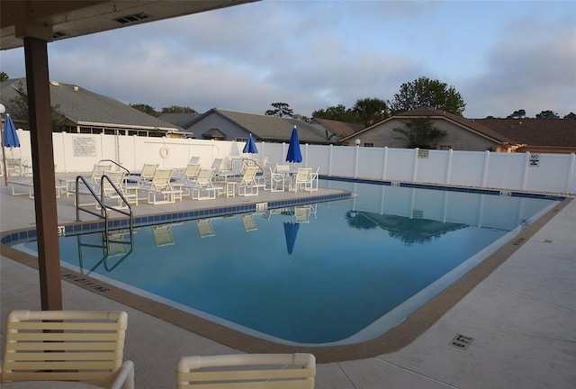 view of swimming pool featuring a patio area