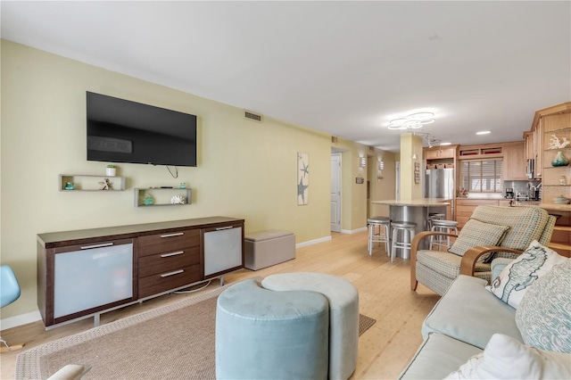 living room featuring light wood-type flooring