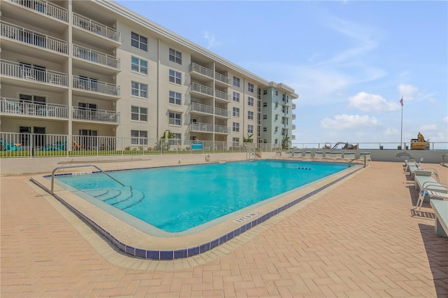 view of pool featuring a patio area