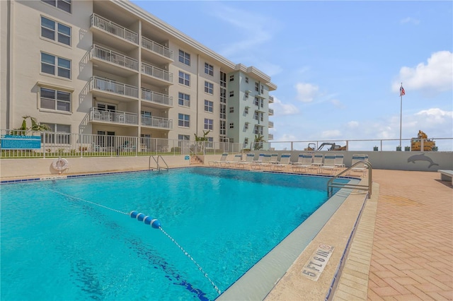 view of pool featuring a patio area