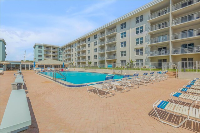 view of swimming pool with a patio area