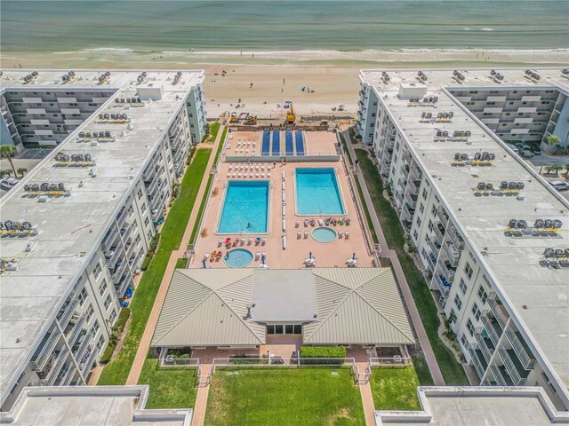 bird's eye view featuring a water view and a view of the beach