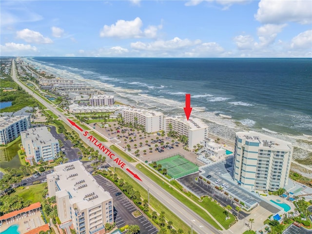 aerial view featuring a water view and a view of the beach